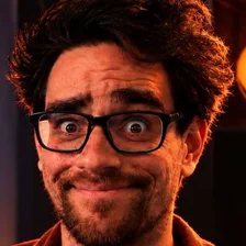 Portrait of Lex van Dommelen, smiling, wearing glasses